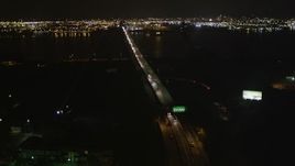 4K aerial stock footage Flying over Newark Bay Bridge, Newark, New Jersey, night Aerial Stock Footage | AX85_140
