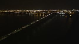 4K aerial stock footage Flying by the Newark Bay Bridge, Newark, New Jersey, night Aerial Stock Footage | AX85_141