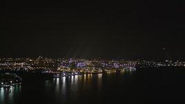 4K aerial stock footage Flying by an oil refinery on the shore, Newark Bay, Newark, New Jersey, night Aerial Stock Footage | AX85_142