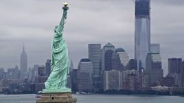 4K aerial stock footage fly around the Statue of Liberty with Lower Manhattan in the background, New York City Aerial Stock Footage | AX86_002