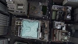 4K aerial stock footage of tilting to a bird's eye view of 40 Wall Street, Lower Manhattan, New York City Aerial Stock Footage | AX86_005
