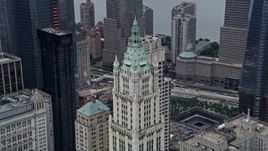 4K aerial stock footage of flying past the top of the Woolworth Building in Lower Manhattan, New York City Aerial Stock Footage | AX86_007