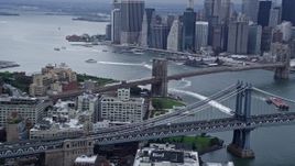 4K aerial stock footage a view of the Brooklyn and Manhattan Bridges, New York City Aerial Stock Footage | AX86_021