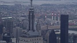 4K aerial stock footage of circling the Empire State Building's spire in Midtown Manhattan, New York City Aerial Stock Footage | AX86_037