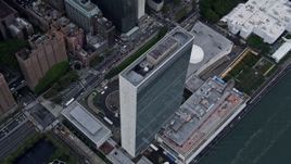 4K aerial stock footage fly away from the top of the United Nations, Midtown Manhattan, New York City Aerial Stock Footage | AX86_041