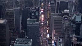 4K aerial stock footage tilting to a view of traffic and tourists in Times Square in Midtown, New York City Aerial Stock Footage | AX86_056
