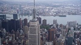 4K aerial stock footage of a reverse view of the Empire State Building in Midtown Manhattan, New York City Aerial Stock Footage | AX86_059