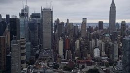 4K aerial stock footage fly past Midtown Manhattan skyscrapers and Empire State Building, New York City Aerial Stock Footage | AX86_062