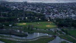 4K aerial stock footage of flying by baseball fields in Jersey City, New Jersey Aerial Stock Footage | AX86_086