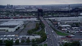 4K aerial stock footage of approaching a small bridge spanning the Passaic River in Kearny, New Jersey Aerial Stock Footage | AX86_087