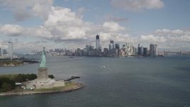 4K aerial stock footage Statue of Liberty, Liberty Island, Lower Manhattan skyline, New York, New York Aerial Stock Footage | AX87_002