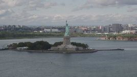 4K aerial stock footage Flying by the Statue of Liberty, Liberty Island,  New York, New York Aerial Stock Footage | AX87_003