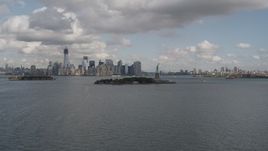 4K aerial stock footage Reveal Statue of Liberty, Lower Manhattan skyline, New York, New York Aerial Stock Footage | AX87_004