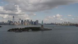 4K aerial stock footage Approach Statue of Liberty, Lower Manhattan skyline, New York, New York Aerial Stock Footage | AX87_005