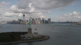 4K aerial stock footage Fly by Statue of Liberty, Lower Manhattan skyline, New York, New York Aerial Stock Footage | AX87_006