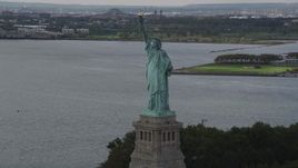 4K aerial stock footage Flying slowly by Statue of Liberty, Liberty Island, New York, New York Aerial Stock Footage | AX87_008