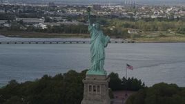 4K aerial stock footage Flying by the front of the Statue of Liberty, Liberty Island, New York, New York Aerial Stock Footage | AX87_009