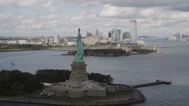 4K aerial stock footage Flying by the front of the Statue of Liberty, Liberty Island, New York, New York Aerial Stock Footage | AX87_014