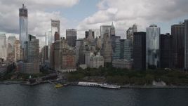 4K aerial stock footage Approaching Lower Manhattan skyscrapers, Battery Park, New York, New York Aerial Stock Footage | AX87_016