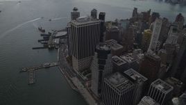 4K aerial stock footage Flying by Lower Manhattan skyscrapers, East River, New York, New York Aerial Stock Footage | AX87_039