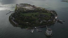 4K aerial stock footage Flying by Governors Island, New York Bay, New York, New York Aerial Stock Footage | AX87_041