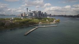4K aerial stock footage Flying by Lower Manhattan skyline, from Governors Island, New York, New York Aerial Stock Footage | AX87_043