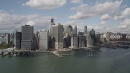 4K aerial stock footage Approaching Lower Manhattan skyscrapers on the shore, New York, New York Aerial Stock Footage | AX87_047
