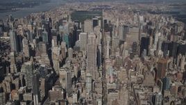 4K aerial stock footage Tilt up to reveal Empire State Building, Midtown Manhattan, New York, New York Aerial Stock Footage | AX87_075