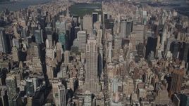 4K aerial stock footage Approaching the Empire State Building, tilt down, Midtown Manhattan, New York Aerial Stock Footage | AX87_076