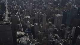4K aerial stock footage Tilt up from Waldorf-Astoria, revealing Midtown Manhattan, New York, New York Aerial Stock Footage | AX87_083