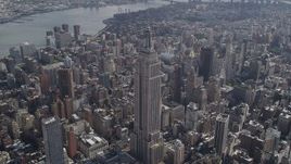 4K aerial stock footage Flying by the Empire State Building, Midtown Manhattan, New York, New York Aerial Stock Footage | AX87_087