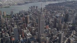 4K aerial stock footage Flying by the Empire State Building, Midtown Manhattan, New York, New York Aerial Stock Footage | AX87_088