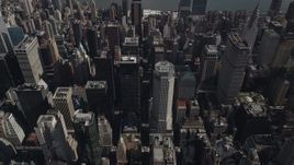 4K aerial stock footage Approaching Midtown Manhattan skyscrapers, tilt down, New York, New York Aerial Stock Footage | AX87_093