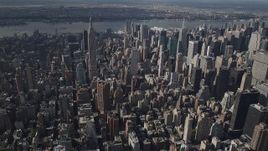 4K aerial stock footage Approaching the Empire State Building, Midtown Manhattan, New York, New York Aerial Stock Footage | AX87_097