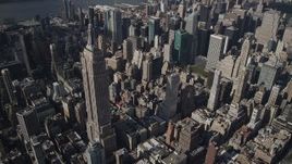 4K aerial stock footage Approaching the Empire State Building, Midtown Manhattan, New York, New York Aerial Stock Footage | AX87_100