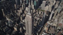 4K aerial stock footage Flying by top of Empire State Building, Midtown Manhattan, New York, New York Aerial Stock Footage | AX87_101