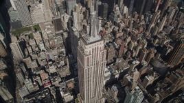 4K aerial stock footage Orbiting the Empire State Building, tilt up,  Midtown Manhattan, New York, New York Aerial Stock Footage | AX87_102