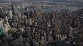 4K aerial stock footage Flying by the Empire State Building, Midtown Manhattan, New York, New York Aerial Stock Footage | AX87_103