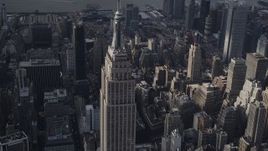 4K aerial stock footage Flying by the top decks of Empire State Building, Midtown Manhattan, New York Aerial Stock Footage | AX87_110