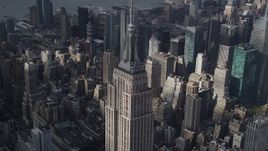 4K aerial stock footage Flying by the top decks of Empire State Building, Midtown Manhattan, New York Aerial Stock Footage | AX87_111