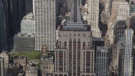 4K aerial stock footage Flying by the top decks of the Empire State Building, Midtown Manhattan, New York Aerial Stock Footage | AX87_113