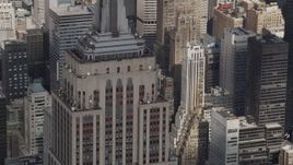 4K aerial stock footage Flying by top decks of the Empire State Building, Midtown Manhattan, New York Aerial Stock Footage | AX87_114