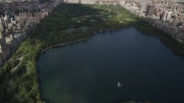 4K aerial stock footage Flying over Jacqueline Kennedy Onassis Reservoir, Central Park, New York, New York Aerial Stock Footage | AX87_122
