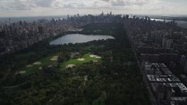 4K aerial stock footage Flying away from Central Park, seen from Harlem, New York, New York Aerial Stock Footage | AX87_125