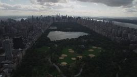 4K aerial stock footage Flying by Central Park, seen while flying west, New York, New York Aerial Stock Footage | AX87_137