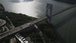 4K aerial stock footage Flying by George Washington Bridge, Hudson River, New York, New York Aerial Stock Footage | AX87_164