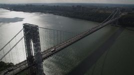 4K aerial stock footage Flying by the George Washington Bridge, Hudson River, New York, New York Aerial Stock Footage | AX87_165