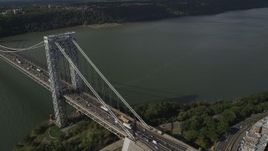 4K aerial stock footage Flying by George Washington Bridge, Hudson River, New York, New York Aerial Stock Footage | AX87_173