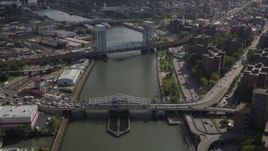 4K aerial stock footage Fly over Harlem River, reveal Madison Avenue Bridge, Park Avenue Bridge, New York Aerial Stock Footage | AX87_179