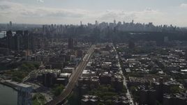 4K aerial stock footage Flying by the Midtown Manhattan skyline, seen from Harlem, New York, New York Aerial Stock Footage | AX87_180